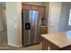 Kitchen features stainless steel refrigerator at 17626 W Calistoga Dr, Surprise, AZ 85387