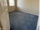 Simple bedroom with neutral carpeting and a window at 17626 W Calistoga Dr, Surprise, AZ 85387