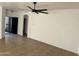 Spacious living room with tile floors and ceiling fan at 13001 W Aster Dr, El Mirage, AZ 85335