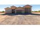 Modern desert home with two-car garage and gravel driveway at 31712 N 169Th Ave, Surprise, AZ 85387
