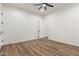 Bright bedroom featuring wood-look floors and a door at 31712 N 169Th Ave, Surprise, AZ 85387