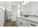 Clean bathroom with white vanity, quartz countertop, and bathtub at 31712 N 169Th Ave, Surprise, AZ 85387