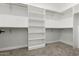 Spacious walk-in closet, offering custom shelving and hanging rods at 31712 N 169Th Ave, Surprise, AZ 85387