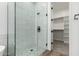 Clean bathroom with a walk-in shower and pebble floor at 31712 N 169Th Ave, Surprise, AZ 85387
