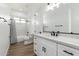 Modern bathroom with white vanity, quartz countertop and shower/tub combo at 31712 N 169Th Ave, Surprise, AZ 85387