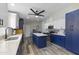 Remodeled kitchen with blue cabinetry, island, and quartz countertops at 8023 E Cholla St, Scottsdale, AZ 85260
