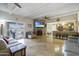 Spacious living room with stone fireplace and tile floors at 8023 E Cholla St, Scottsdale, AZ 85260