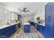 Remodeled kitchen with blue cabinetry, island, and quartz countertops at 8023 E Cholla St, Scottsdale, AZ 85260