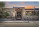 Ornate iron gate leading to a charming Spanish-style home at 8023 E Cholla St, Scottsdale, AZ 85260