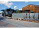 Modern home entrance with sleek architectural details and water feature at 17807 E Silver Sage Ln, Rio Verde, AZ 85263