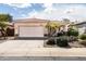 One-story home with a two-car garage and desert landscaping at 1845 E Sycamore Rd, Casa Grande, AZ 85122