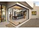 Modern dining room with glass walls and a view of the patio at 41851 N 112Th Pl, Scottsdale, AZ 85262