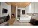 Bright bedroom with wood ceiling and built-in fireplace at 41851 N 112Th Pl, Scottsdale, AZ 85262