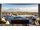 Covered patio with fire pit overlooking the mountains at 41851 N 112Th Pl, Scottsdale, AZ 85262