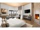 Luxurious bedroom with fireplace and mountain views at 41851 N 112Th Pl, Scottsdale, AZ 85262