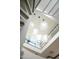 Modern glass globe chandelier in a two story entry at 41851 N 112Th Pl, Scottsdale, AZ 85262