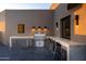 Upscale outdoor kitchen with a built-in grill and marble countertops at 41851 N 112Th Pl, Scottsdale, AZ 85262
