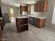 Spacious kitchen with island and wood cabinets at 48230 W Gaveston Ct, Maricopa, AZ 85139
