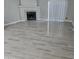 Bright living room with fireplace and tile flooring at 48230 W Gaveston Ct, Maricopa, AZ 85139