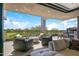 Spacious patio with outdoor seating, fire pit, and golf course views at 37200 N Cave Creek Rd # 2124, Scottsdale, AZ 85262