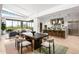 Open dining area with modern dark wood table and light beige chairs at 37200 N Cave Creek Rd # 2124, Scottsdale, AZ 85262