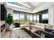 Spacious living room with sectional sofa, fireplace, and sliding glass doors leading to a patio with scenic views at 37200 N Cave Creek Rd # 2124, Scottsdale, AZ 85262