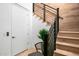 Modern staircase with metal railing and light wood steps at 37200 N Cave Creek Rd # 2124, Scottsdale, AZ 85262