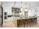 Gourmet kitchen with marble island, white cabinets, and high-end appliances at 37200 N Cave Creek Rd # 2124, Scottsdale, AZ 85262