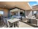 Large patio with dining area and comfortable seating overlooking the golf course at 37200 N Cave Creek Rd # 2124, Scottsdale, AZ 85262