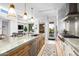 Modern kitchen with marble countertops, stainless steel appliances, and an island at 37200 N Cave Creek Rd # 2124, Scottsdale, AZ 85262