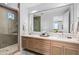 Spa-like bathroom with double vanity, large mirror, and walk-in shower at 37200 N Cave Creek Rd # 2124, Scottsdale, AZ 85262
