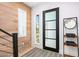 Bright entryway with wood wall, modern door, and stylish rug at 37200 N Cave Creek Rd # 2124, Scottsdale, AZ 85262