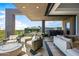 Outdoor patio with comfortable seating, fire pit, and grill at 37200 N Cave Creek Rd # 2124, Scottsdale, AZ 85262