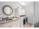 Modern laundry room with side-by-side washer and dryer and built in cabinets at 37200 N Cave Creek Rd # 2124, Scottsdale, AZ 85262
