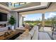 Living room with sectional sofa, fireplace and access to outdoor patio at 37200 N Cave Creek Rd # 2124, Scottsdale, AZ 85262