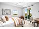 Bright bedroom with king-size bed, balcony access, and mountain views at 37200 N Cave Creek Rd # 2124, Scottsdale, AZ 85262