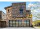 Modern home exterior with stone and wood accents at 37200 N Cave Creek Rd # 2124, Scottsdale, AZ 85262