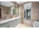 Modern bathroom with double vanity, large mirror, and walk-in shower at 37200 N Cave Creek Rd # 2124, Scottsdale, AZ 85262