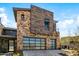 Modern home exterior with stone and wood accents at 37200 N Cave Creek Rd # 2124, Scottsdale, AZ 85262