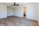 Primary bedroom with en-suite bathroom and wood-look flooring at 723 N Moon Rd, Apache Junction, AZ 85119