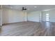 Spacious living room featuring wood-look tile floors and an open floor plan at 723 N Moon Rd, Apache Junction, AZ 85119