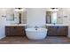 Modern bathroom with double vanity, soaking tub, and tile flooring at 723 N Moon Rd, Apache Junction, AZ 85119