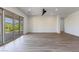 Bright and airy living room with large sliding glass doors and wood-look tile floors at 723 N Moon Rd, Apache Junction, AZ 85119