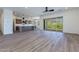 Open living room with kitchen views and sliding glass doors at 723 N Moon Rd, Apache Junction, AZ 85119