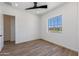 Spacious bedroom with ceiling fan and large window at 723 N Moon Rd, Apache Junction, AZ 85119