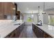 Modern kitchen with stainless steel appliances and custom wood cabinets at 723 N Moon Rd, Apache Junction, AZ 85119