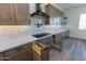 Modern kitchen with a large island and custom wood cabinets at 723 N Moon Rd, Apache Junction, AZ 85119