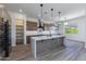 Modern kitchen with a large island, custom cabinetry, and quartz countertops at 723 N Moon Rd, Apache Junction, AZ 85119