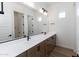 Double vanity bathroom with modern light fixtures and large mirror at 723 N Moon Rd, Apache Junction, AZ 85119