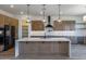 Modern kitchen with large island, ample cabinetry, and high-end appliances at 723 N Moon Rd, Apache Junction, AZ 85119
